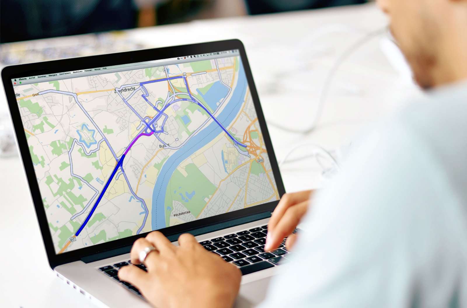Traffic analyst reviewing origin-destination route patterns on a digital road network map