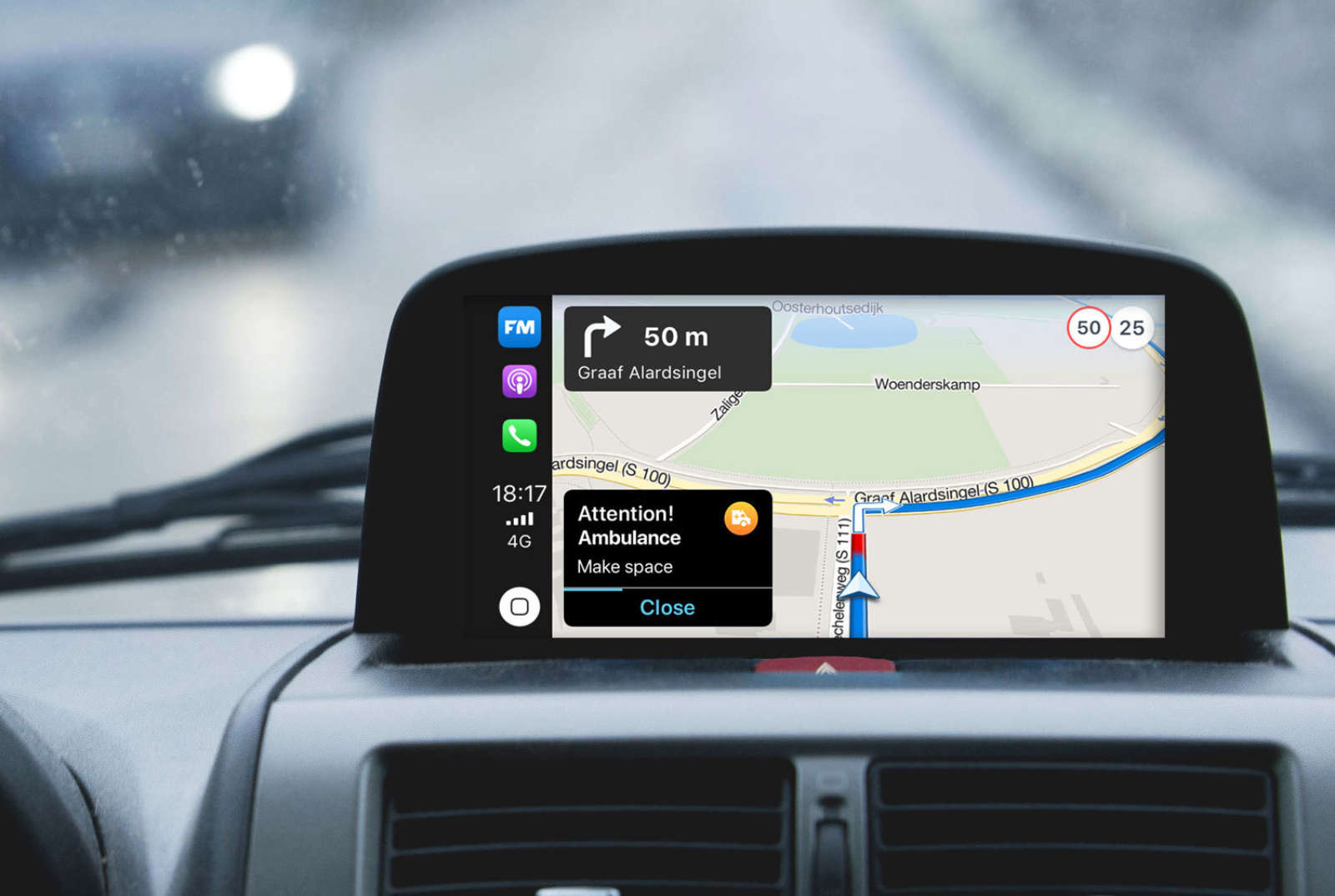 In-car dashboard showing a Flitsmeister ambulance warning — Be-Mobile Safety Priority Services